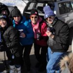 Several club members pose in the Dodge Nature Center parking lot after snow shoeing