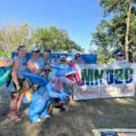 MNDBC club members in parade. Highlight is club member Kristine dressed in an inflatable dragon costume in which she is the rider of the dragon.